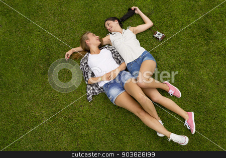 To use this stock image in your creative project, please select the size you need over to the right and click the "Add to Cart" button.
Your downloaded image will come with the Cutcaster watermark removed so don’t worry about the watermark you see on this page. Best Friends stock photo, Female best Friends lying on the grass and having a good time together by ikostudio