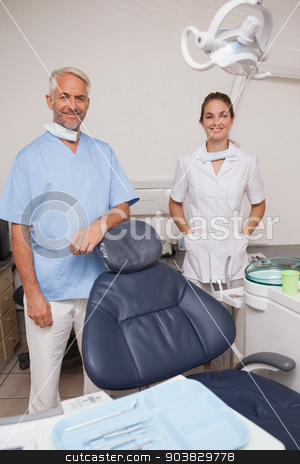 To use this stock image in your creative project, please select the size you need over to the right and click the "Add to Cart" button.
Your downloaded image will come with the Cutcaster watermark removed so don’t worry about the watermark you see on this page. Dentist and assistant smiling at camera inviting you to the chai stock photo, Dentist and assistant smiling at camera inviting you to the chair at the dental clinic by Wavebreak Media