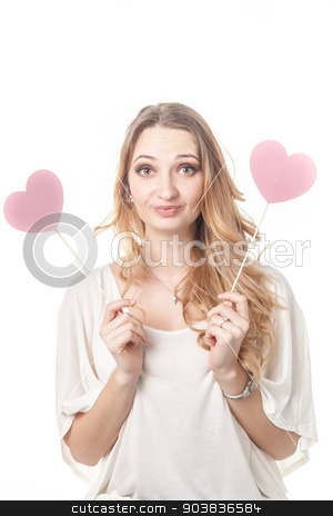 To use this stock image in your creative project, please select the size you need over to the right and click the "Add to Cart" button.
Your downloaded image will come with the Cutcaster watermark removed so don’t worry about the watermark you see on this page. Girl fun posing with two hearts in studio stock photo, Cute lady having fun and posing with two St Valentine hearts in studio by Oleksandr Solonenko