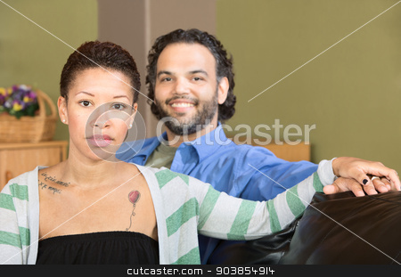 To use this stock image in your creative project, please select the size you need over to the right and click the "Add to Cart" button.
Your downloaded image will come with the Cutcaster watermark removed so don’t worry about the watermark you see on this page. Serious Woman and Smiling Man stock photo, Smiling man sitting with serious Black woman by Scott Griessel