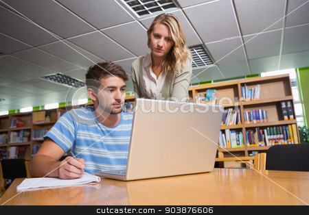 To use this stock image in your creative project, please select the size you need over to the right and click the "Add to Cart" button.
Your downloaded image will come with the Cutcaster watermark removed so don’t worry about the watermark you see on this page. Student getting help from tutor in library stock photo, Student getting help from tutor in library at the university by Wavebreak Media