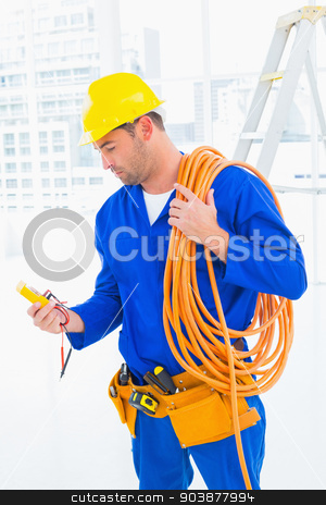 To use this stock image in your creative project, please select the size you need over to the right and click the "Add to Cart" button.
Your downloaded image will come with the Cutcaster watermark removed so don’t worry about the watermark you see on this page. Electrician reading multimeter in bright office stock photo, Male electrician with wire roll looking at reading multimeter in bright office by Wavebreak Media
