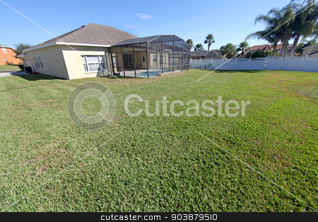 To use this stock image in your creative project, please select the size you need over to the right and click the "Add to Cart" button.
Your downloaded image will come with the Cutcaster watermark removed so don’t worry about the watermark you see on this page. Yard stock photo, A large yard of a home in Florida by Lucy Clark