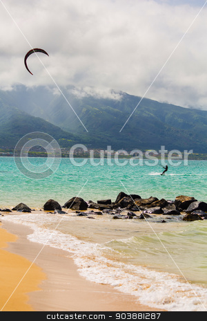 To use this stock image in your creative project, please select the size you need over to the right and click the "Add to Cart" button.
Your downloaded image will come with the Cutcaster watermark removed so don’t worry about the watermark you see on this page. Kite Surfer on Beach stock photo, Maui kite surfer on shore at Kanaha Beach Park by Scott Griessel