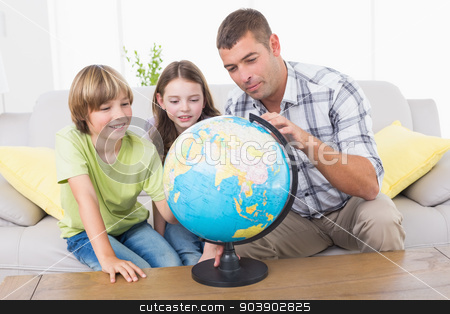 To use this stock image in your creative project, please select the size you need over to the right and click the "Add to Cart" button.
Your downloaded image will come with the Cutcaster watermark removed so don’t worry about the watermark you see on this page. Family exploring globe stock photo, Father and children exploring globe in living room by Wavebreak Media