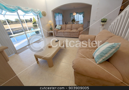 To use this stock image in your creative project, please select the size you need over to the right and click the "Add to Cart" button.
Your downloaded image will come with the Cutcaster watermark removed so don’t worry about the watermark you see on this page. Living Room stock photo, A Living Room in a Home in Florida by Lucy Clark