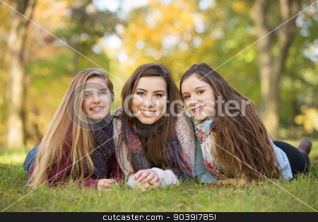 To use this stock image in your creative project, please select the size you need over to the right and click the "Add to Cart" button.
Your downloaded image will come with the Cutcaster watermark removed so don’t worry about the watermark you see on this page. Trio of Friends stock photo, Three happy Caucasian teen girls sitting together by Scott Griessel