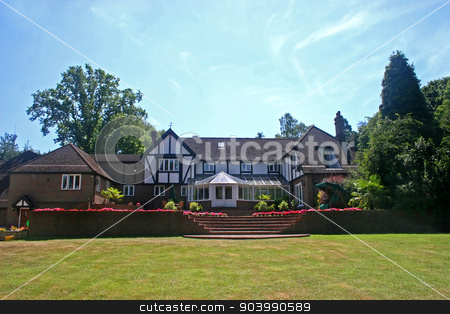 To use this stock image in your creative project, please select the size you need over to the right and click the "Add to Cart" button.
Your downloaded image will come with the Cutcaster watermark removed so don’t worry about the watermark you see on this page. Tudor Home stock photo, A large estate home, tudor style, in the UK by Lucy Clark