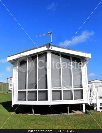 To use this stock image in your creative project, please select the size you need over to the right and click the "Add to Cart" button.
Your downloaded image will come with the Cutcaster watermark removed so don’t worry about the watermark you see on this page. Modern white caravan exterior stock photo, Exterior of a modern white caravan on a park in summer. by Martin Crowdy