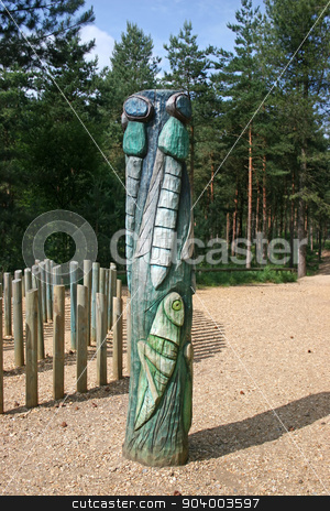 To use this stock image in your creative project, please select the size you need over to the right and click the "Add to Cart" button.
Your downloaded image will come with the Cutcaster watermark removed so don’t worry about the watermark you see on this page. Totem Pole stock photo, A total pole with a cricket and flies in the forest by Lucy Clark