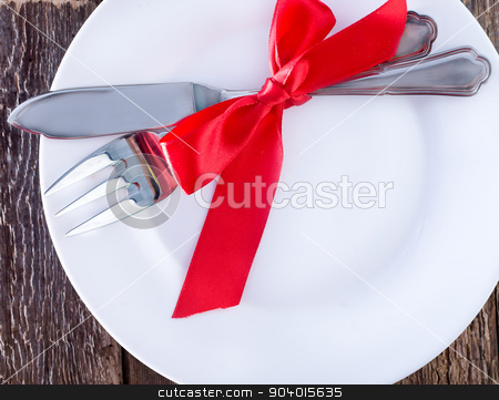 To use this stock image in your creative project, please select the size you need over to the right and click the "Add to Cart" button.
Your downloaded image will come with the Cutcaster watermark removed so don’t worry about the watermark you see on this page. fork and knife on a table stock photo, fork and knife on plate and on a table by tycoon