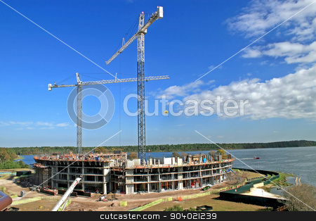 To use this stock image in your creative project, please select the size you need over to the right and click the "Add to Cart" button.
Your downloaded image will come with the Cutcaster watermark removed so don’t worry about the watermark you see on this page. Building Construction stock photo, The construction of a building with 2 cranes by Lucy Clark
