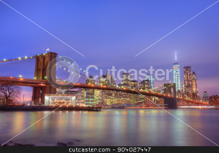To use this stock image in your creative project, please select the size you need over to the right and click the "Add to Cart" button.
Your downloaded image will come with the Cutcaster watermark removed so don’t worry about the watermark you see on this page. Brooklyn bridge at dusk, New York City. stock photo, Brooklyn bridge and New York City Manhattan downtown skyline at dusk with skyscrapers illuminated over East River panorama. Copy space. by kasto