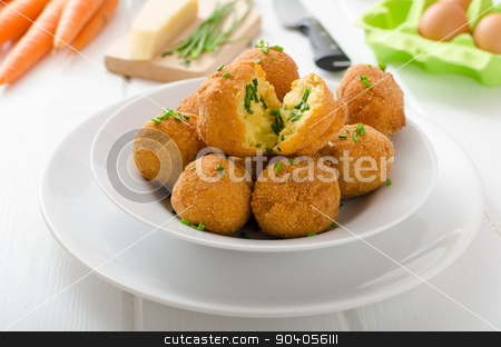 To use this stock image in your creative project, please select the size you need over to the right and click the "Add to Cart" button.
Your downloaded image will come with the Cutcaster watermark removed so don’t worry about the watermark you see on this page. Homemade potato croquettes with parmesan and chives stock photo, Homemade potato croquettes with parmesan and chives, nice and simple, but delicious light food by Peteer