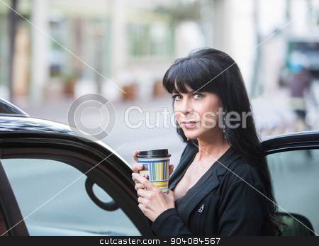 To use this stock image in your creative project, please select the size you need over to the right and click the "Add to Cart" button.
Your downloaded image will come with the Cutcaster watermark removed so don’t worry about the watermark you see on this page. Beautiful Woman Downtown with Coffee stock photo, Attractive woman downtown in the morning with coffee cup by Scott Griessel