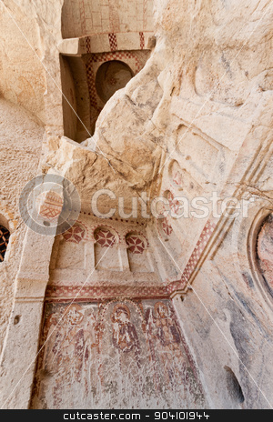 To use this stock image in your creative project, please select the size you need over to the right and click the "Add to Cart" button.
Your downloaded image will come with the Cutcaster watermark removed so don’t worry about the watermark you see on this page. Sandstone Church Detail at Cappadocia stock photo, Goreme church remains with historic vandalism in Cappadocia Turkey by Scott Griessel
