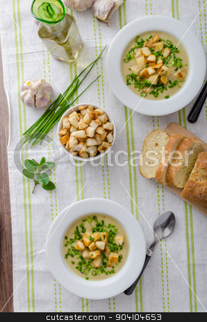 To use this stock image in your creative project, please select the size you need over to the right and click the "Add to Cart" button.
Your downloaded image will come with the Cutcaster watermark removed so don’t worry about the watermark you see on this page. Garlic soup with croutons, spring onions and chives stock photo, Garlic soup - bio garlic, red onion, all natural ingredients, eat clean by Peteer