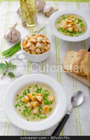 To use this stock image in your creative project, please select the size you need over to the right and click the "Add to Cart" button.
Your downloaded image will come with the Cutcaster watermark removed so don’t worry about the watermark you see on this page. Garlic soup with croutons, spring onions and chives stock photo, Garlic soup - bio garlic, red onion, all natural ingredients, eat clean by Peteer