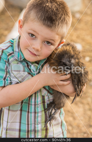 To use this stock image in your creative project, please select the size you need over to the right and click the "Add to Cart" button.
Your downloaded image will come with the Cutcaster watermark removed so don’t worry about the watermark you see on this page. Boy Hugging Pet Chicken stock photo, Smiling boy outside hugs his pet chicken by Scott Griessel