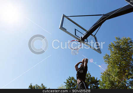 To use this stock image in your creative project, please select the size you need over to the right and click the "Add to Cart" button.
Your downloaded image will come with the Cutcaster watermark removed so don’t worry about the watermark you see on this page. Basketball Dunk Outdoors stock photo, Young basketball player driving to the hoop for a high flying slam dunk. by Todd Arena