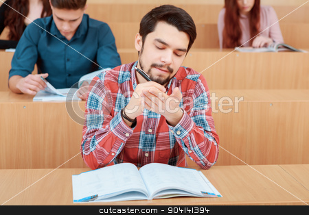 To use this stock image in your creative project, please select the size you need over to the right and click the "Add to Cart" button.
Your downloaded image will come with the Cutcaster watermark removed so don’t worry about the watermark you see on this page. Student studies at class stock photo, Get prepared for the test. Young bearded student puts some test answers on his palm so that he could cheat on test by Zinkevych