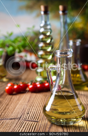 To use this stock image in your creative project, please select the size you need over to the right and click the "Add to Cart" button.
Your downloaded image will come with the Cutcaster watermark removed so don’t worry about the watermark you see on this page. Olive oil bottle, Mediterranean rural theme stock photo, Olive oil bottle, Mediterranean rural theme by Sebastian Duda