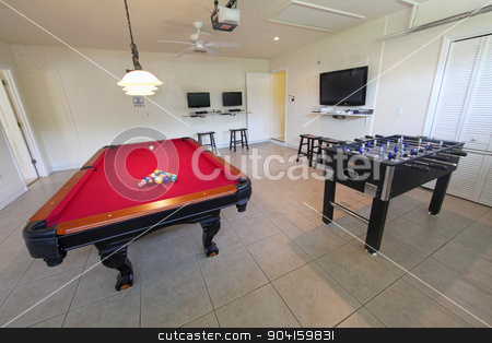 To use this stock image in your creative project, please select the size you need over to the right and click the "Add to Cart" button.
Your downloaded image will come with the Cutcaster watermark removed so don’t worry about the watermark you see on this page. Games Room stock photo, A games room with pool table and foosball by Lucy Clark