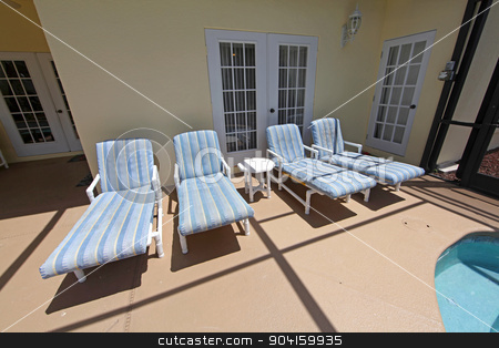To use this stock image in your creative project, please select the size you need over to the right and click the "Add to Cart" button.
Your downloaded image will come with the Cutcaster watermark removed so don’t worry about the watermark you see on this page. Pool Chairs stock photo, Four pool loungers in a pool area by Lucy Clark