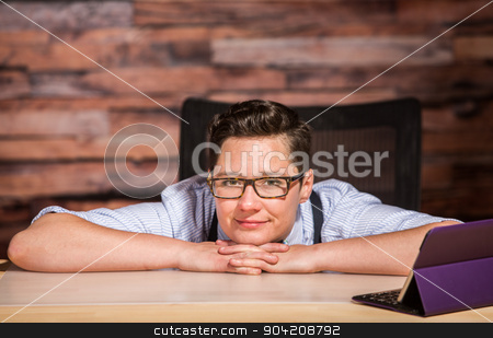 To use this stock image in your creative project, please select the size you need over to the right and click the "Add to Cart" button.
Your downloaded image will come with the Cutcaster watermark removed so don’t worry about the watermark you see on this page. Dapper Woman in Bowtie with Tablet stock photo, Dapper woman in glasses sitting at modern desk with a tablet by Scott Griessel