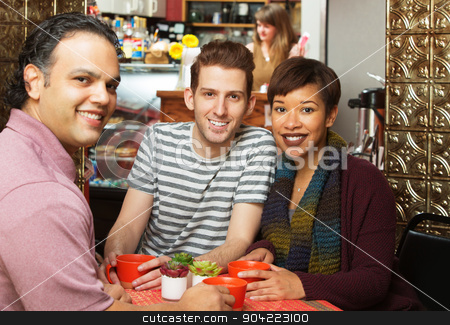 To use this stock image in your creative project, please select the size you need over to the right and click the "Add to Cart" button.
Your downloaded image will come with the Cutcaster watermark removed so don’t worry about the watermark you see on this page. Three People in Cafe stock photo, Three young adults at coffee house indoors by Scott Griessel