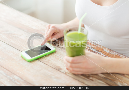 To use this stock image in your creative project, please select the size you need over to the right and click the "Add to Cart" button.
Your downloaded image will come with the Cutcaster watermark removed so don’t worry about the watermark you see on this page. close up of woman with smartphone and green juice stock photo, healthy eating, diet, detox, technology and people concept - close up of woman with smartphone and green juice sitting at wooden table by Syda Productions