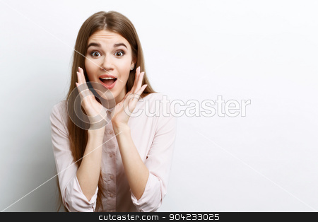 To use this stock image in your creative project, please select the size you need over to the right and click the "Add to Cart" button.
Your downloaded image will come with the Cutcaster watermark removed so don’t worry about the watermark you see on this page. Beautiful girl showing emotions stock photo, Wow. Portrait of a young beautiful girl with long brown hair wearing pink cotton blouse, standing waist up looking excited holding her mouth opened and hands near it, on a white background by Zinkevych