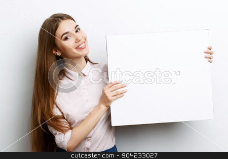 To use this stock image in your creative project, please select the size you need over to the right and click the "Add to Cart" button.
Your downloaded image will come with the Cutcaster watermark removed so don’t worry about the watermark you see on this page. Beautiful girl with copy space stock photo, Portrait of a young beautiful girl with long brown hair wearing pink cotton blouse, standing waist up smiling and holding a copy space in her hands charming , on a white background by Zinkevych