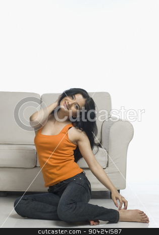 To use this stock image in your creative project, please select the size you need over to the right and click the "Add to Cart" button.
Your downloaded image will come with the Cutcaster watermark removed so don’t worry about the watermark you see on this page. pims_20090226_sh0640.jpg stock photo, Young woman stretching near a couch by imagedb