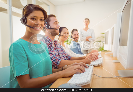 To use this stock image in your creative project, please select the size you need over to the right and click the "Add to Cart" button.
Your downloaded image will come with the Cutcaster watermark removed so don’t worry about the watermark you see on this page. Call center agent working under a manager supervision stock photo, Portrait of pretty call center agent working under a manager supervision by Wavebreak Media