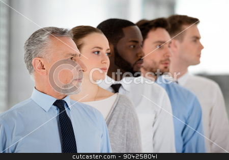 To use this stock image in your creative project, please select the size you need over to the right and click the "Add to Cart" button.
Your downloaded image will come with the Cutcaster watermark removed so don’t worry about the watermark you see on this page. Concept for multi-ethnic business team stock photo, Multi-ethnic business team standing in a row and looking forward purposefully by Dmytro Sidelnikov
