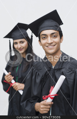 To use this stock image in your creative project, please select the size you need over to the right and click the "Add to Cart" button.
Your downloaded image will come with the Cutcaster watermark removed so don’t worry about the watermark you see on this page. pims_20091113_sa0514.JPG stock photo, Couple in graduation gowns holding diplomas and smiling by imagedb