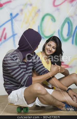 To use this stock image in your creative project, please select the size you need over to the right and click the "Add to Cart" button.
Your downloaded image will come with the Cutcaster watermark removed so don’t worry about the watermark you see on this page. pims_20091113_sa0948.JPG stock photo, Couple sitting with a skateboard in front of a graffiti covered wall by imagedb