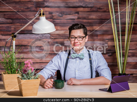 To use this stock image in your creative project, please select the size you need over to the right and click the "Add to Cart" button.
Your downloaded image will come with the Cutcaster watermark removed so don’t worry about the watermark you see on this page. Lesbian in Stylish Office at Wood Desk stock photo, Dapper suspender wearing woman at stylish office desk by Scott Griessel