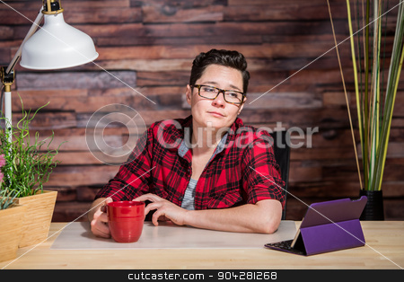 To use this stock image in your creative project, please select the size you need over to the right and click the "Add to Cart" button.
Your downloaded image will come with the Cutcaster watermark removed so don’t worry about the watermark you see on this page. Bored Lady in Red Looking at Tablet stock photo, Bored woman in red shirt looking at tablet computer by Scott Griessel