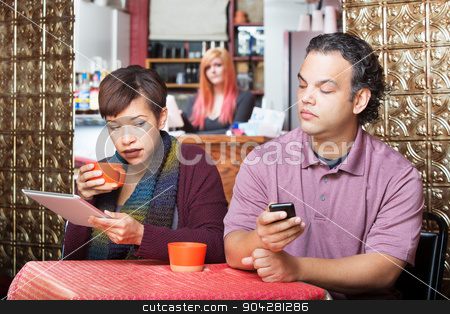 To use this stock image in your creative project, please select the size you need over to the right and click the "Add to Cart" button.
Your downloaded image will come with the Cutcaster watermark removed so don’t worry about the watermark you see on this page. Couple Sneaking with Digital Devices stock photo, Young adult couple at cafe sneaking a peek at their devices by Scott Griessel