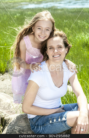To use this stock image in your creative project, please select the size you need over to the right and click the "Add to Cart" button.
Your downloaded image will come with the Cutcaster watermark removed so don’t worry about the watermark you see on this page. Young mother and her young daughter fun time together outdoors. stock photo, A Young mother and her young daughter fun time together outdoors. by Louis-Paul St-Onge