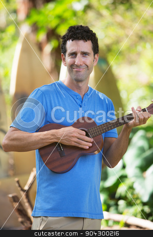 To use this stock image in your creative project, please select the size you need over to the right and click the "Add to Cart" button.
Your downloaded image will come with the Cutcaster watermark removed so don’t worry about the watermark you see on this page. Ukelele Performer in Hawaii stock photo, Cute male playing ukelele outdoors in Hawaii by Scott Griessel