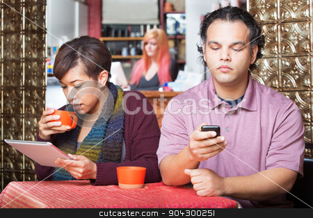 To use this stock image in your creative project, please select the size you need over to the right and click the "Add to Cart" button.
Your downloaded image will come with the Cutcaster watermark removed so don’t worry about the watermark you see on this page. Distracted Couple Using Devices stock photo, Young distracted African American couple using digital devices in cafe by Scott Griessel