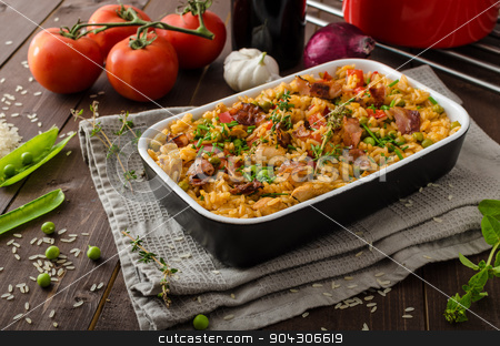 To use this stock image in your creative project, please select the size you need over to the right and click the "Add to Cart" button.
Your downloaded image will come with the Cutcaster watermark removed so don’t worry about the watermark you see on this page. Cajun chicken with rice stock photo, Cajun chicken with rice, full of flavor and hot spices with fresh vegetable bio peas by Peteer