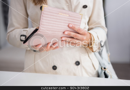 To use this stock image in your creative project, please select the size you need over to the right and click the "Add to Cart" button.
Your downloaded image will come with the Cutcaster watermark removed so don’t worry about the watermark you see on this page. Woman opening her wallet stock photo, Woman opening her wallet at a boutique by Wavebreak Media