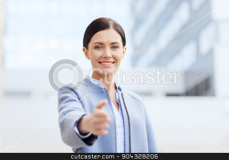 To use this stock image in your creative project, please select the size you need over to the right and click the "Add to Cart" button.
Your downloaded image will come with the Cutcaster watermark removed so don’t worry about the watermark you see on this page. smiling businesswoman giving hand for handshake stock photo, business, partnership, cooperation and people concept - young smiling businesswoman giving hand for handshake over office building by Syda Productions