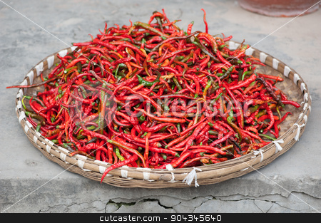 To use this stock image in your creative project, please select the size you need over to the right and click the "Add to Cart" button.
Your downloaded image will come with the Cutcaster watermark removed so don’t worry about the watermark you see on this page. Red pepper drying outdoors stock photo, Red pepper drying outdoors in a basket - Chongzhou, Sichuan Province, China by LP2Studio