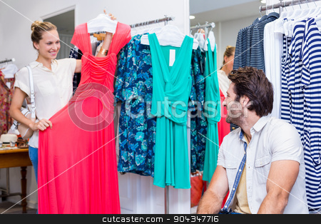 To use this stock image in your creative project, please select the size you need over to the right and click the "Add to Cart" button.
Your downloaded image will come with the Cutcaster watermark removed so don’t worry about the watermark you see on this page. Smiling woman showing red dress to boyfriend stock photo, Smiling woman showing red dress to boyfriend in clothing store by Wavebreak Media