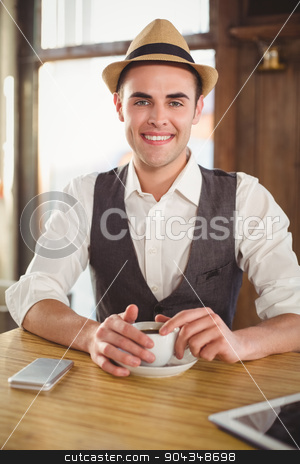 To use this stock image in your creative project, please select the size you need over to the right and click the "Add to Cart" button.
Your downloaded image will come with the Cutcaster watermark removed so don’t worry about the watermark you see on this page. Smiling hipster with cup of coffee stock photo, Portrait of smiling hipster with cup of coffee at coffee shop by Wavebreak Media